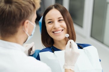 male professional dentist with gloves mask